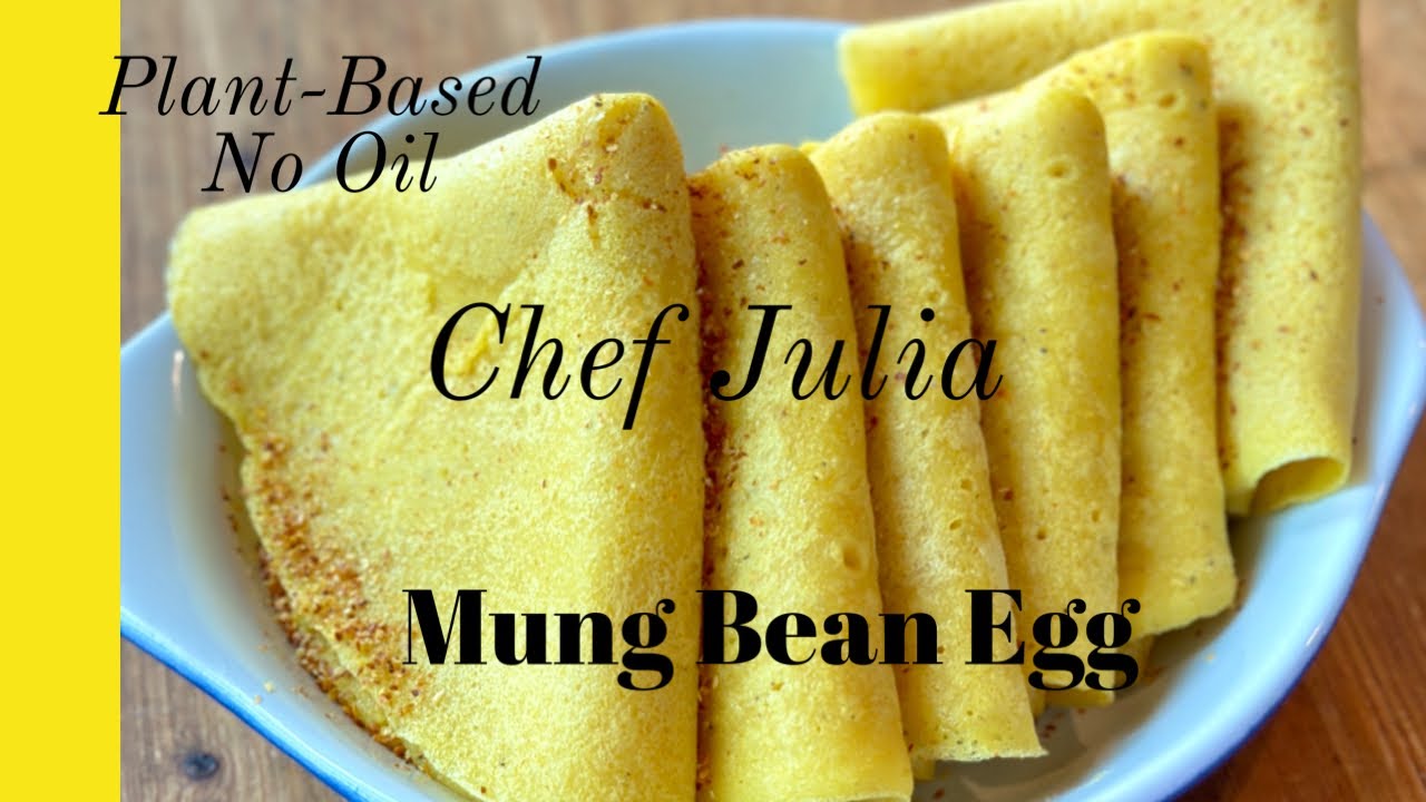Folded mung bean eggs on a blue plate, a plant-based egg alternative by Chef Julia Dunaway